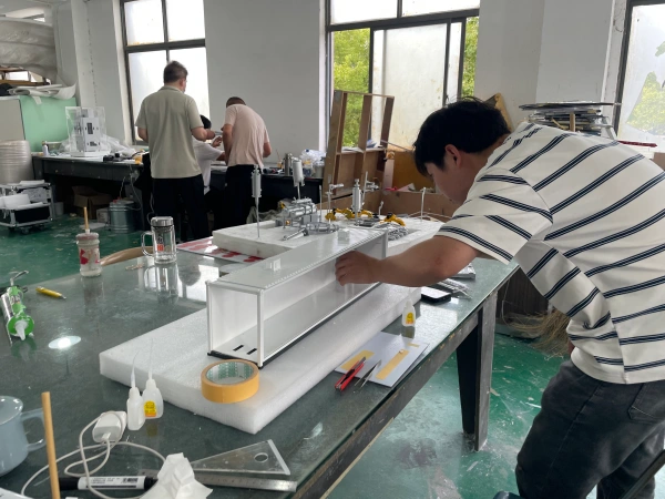 Crafting custom industrial equipment model in workshop, high precision machinery scale model fabrication